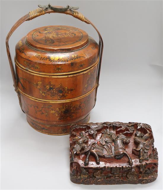 A Chinese carving and a picnic basket
